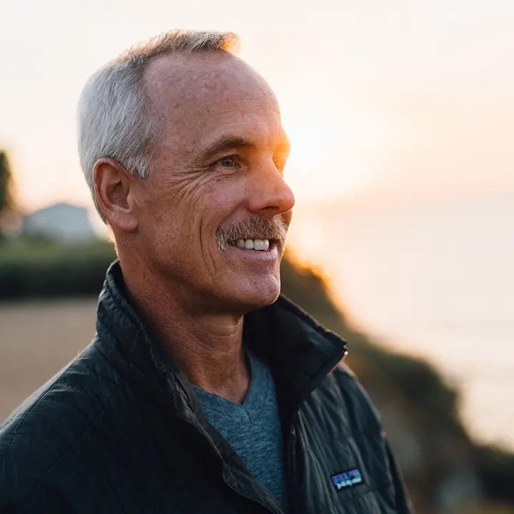Side view of smiling man.