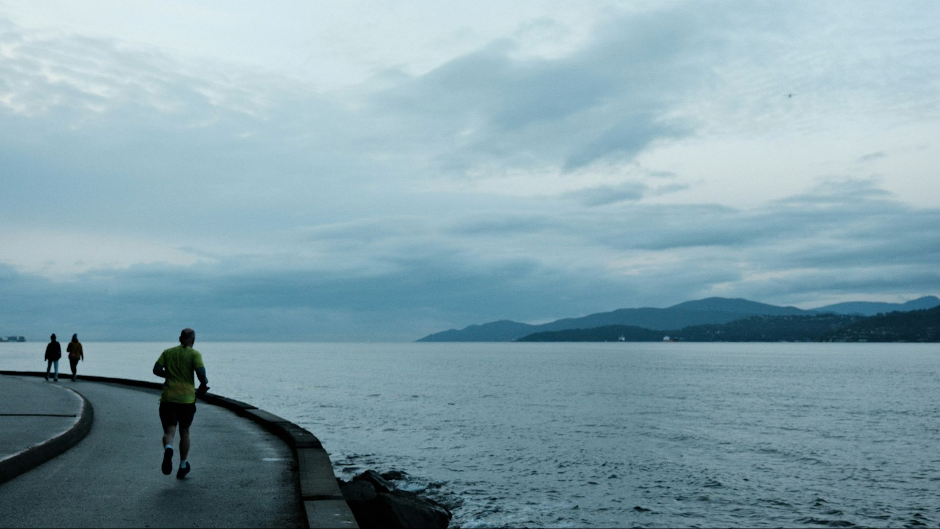 Runner racing along the waterfront in Vancouver