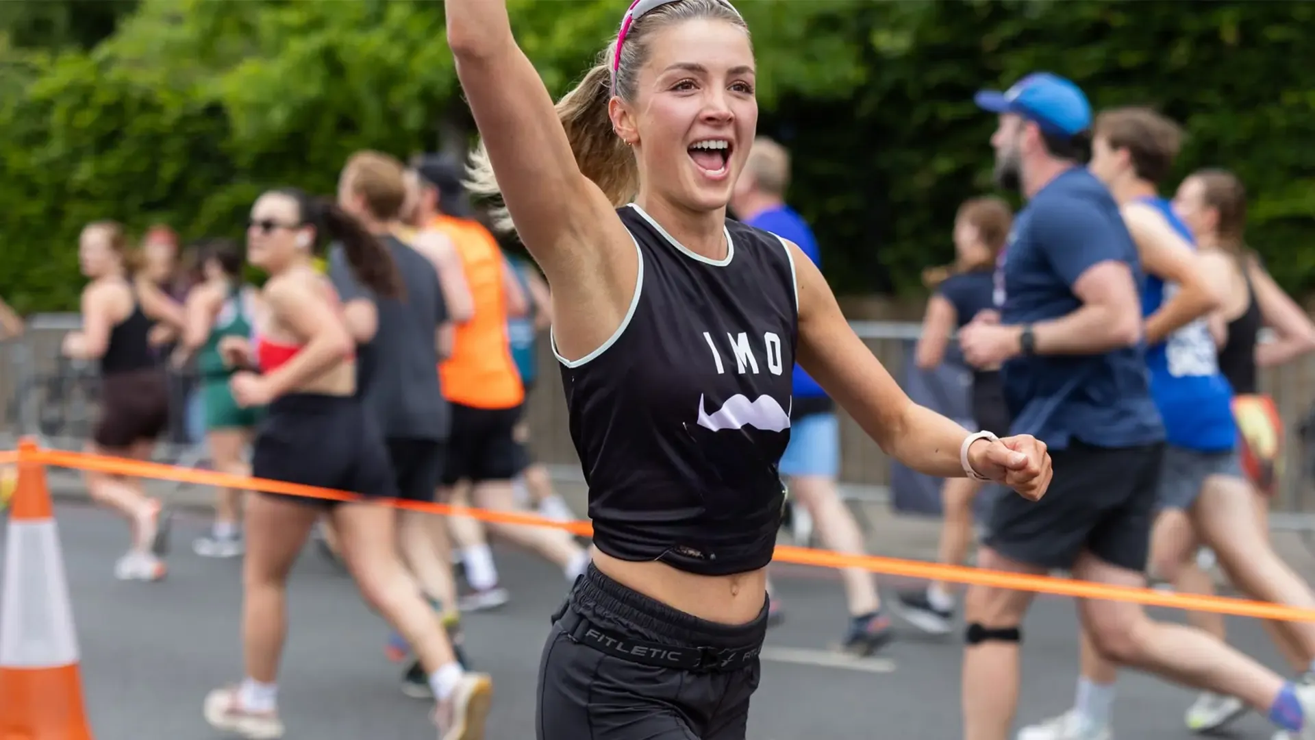 Smiling woman running a marathon
