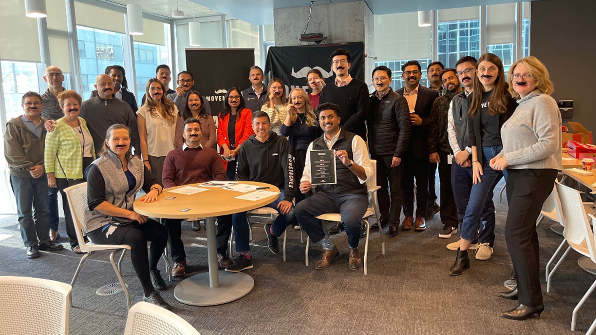 RBC team members gather to celebrate their fundraising efforts for men's health.