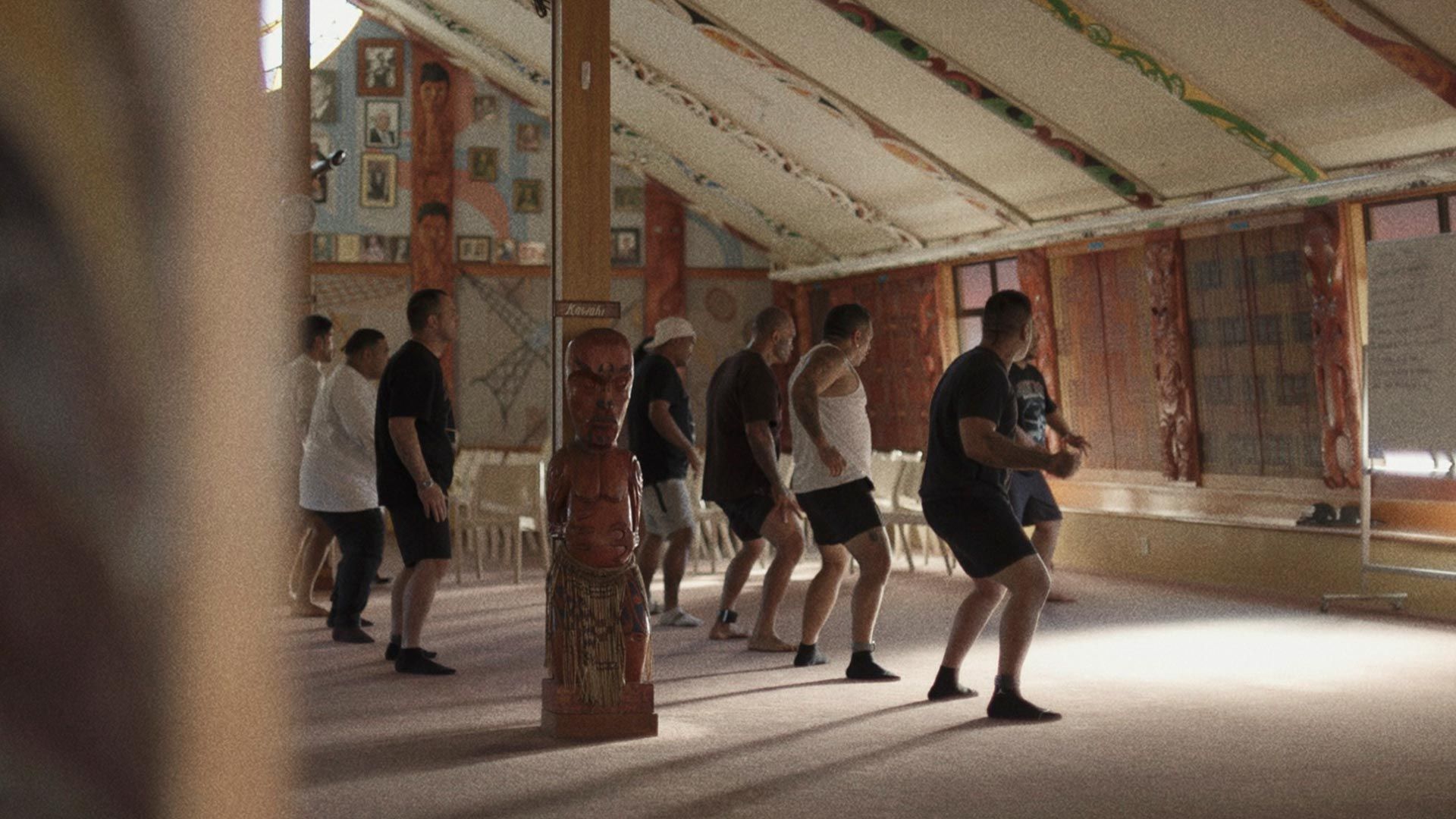 A group of Maori men performing a Haka dance.