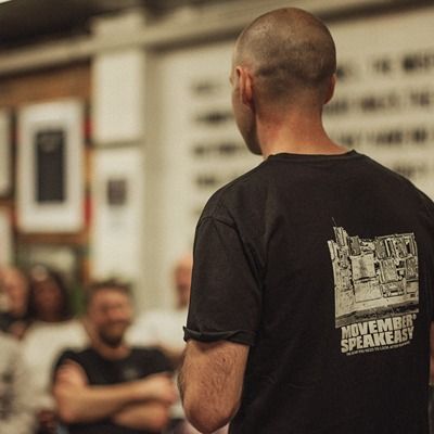 Photo of man giving a talk to a class.