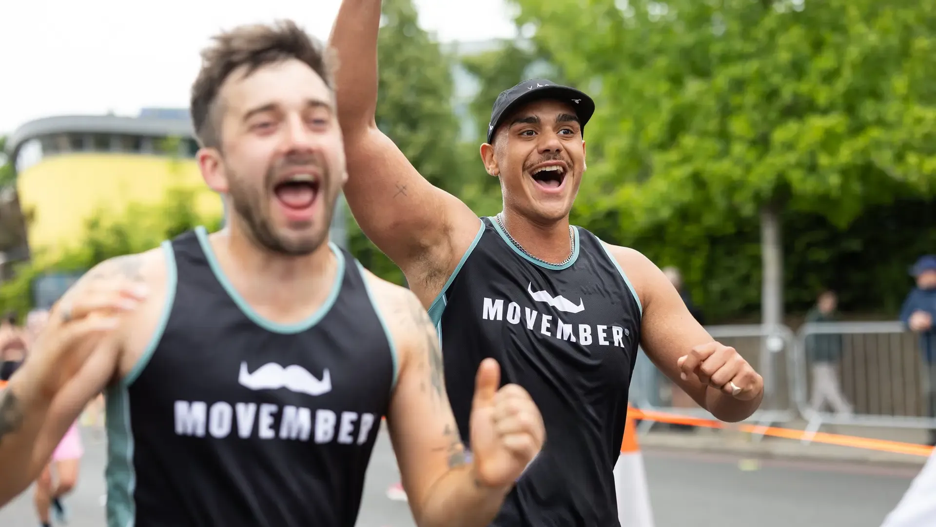 Two Movember runners smiling