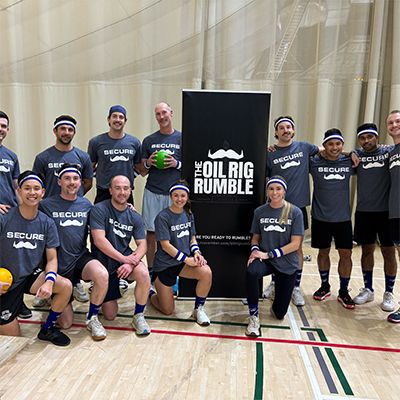 Photo of a corporate dodgeball team posing to camera.