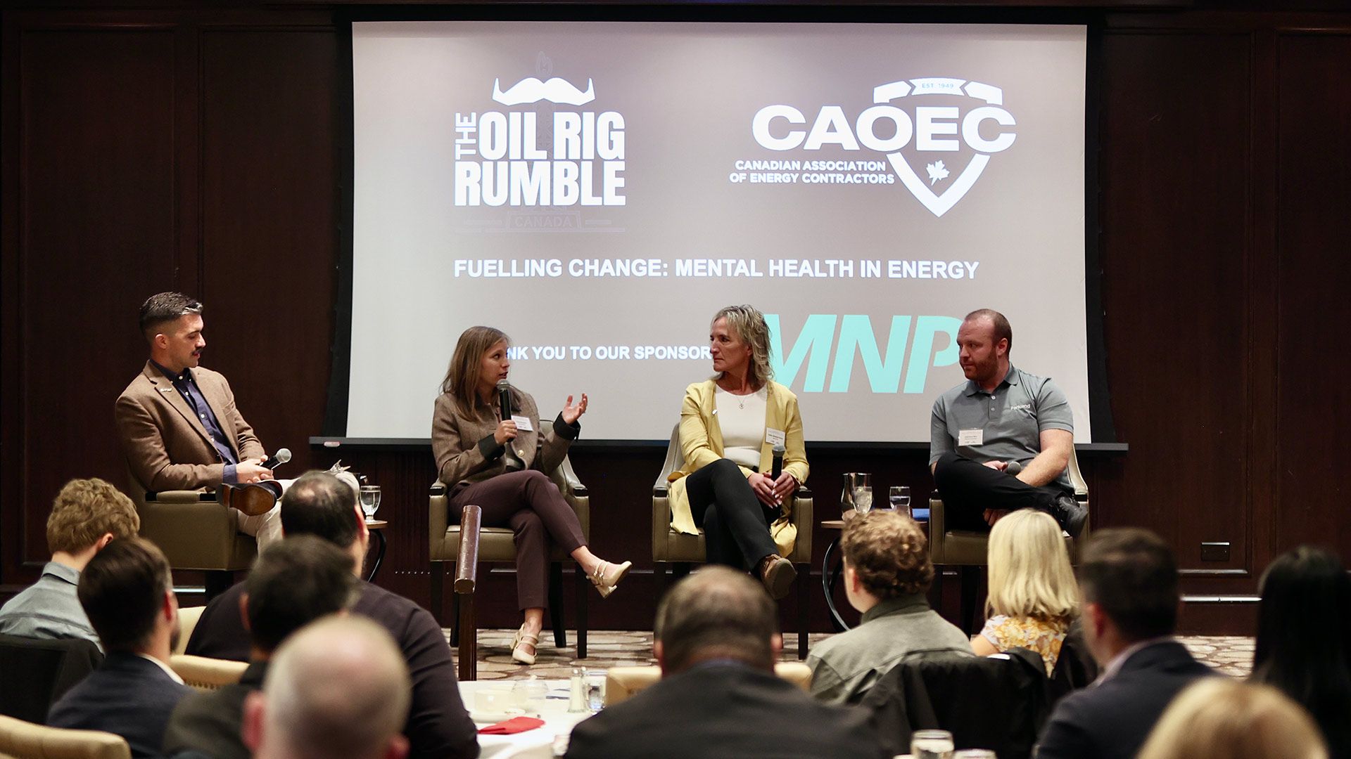 Photo of a talk at a Movember Oil Rig Rumble panel discussion.